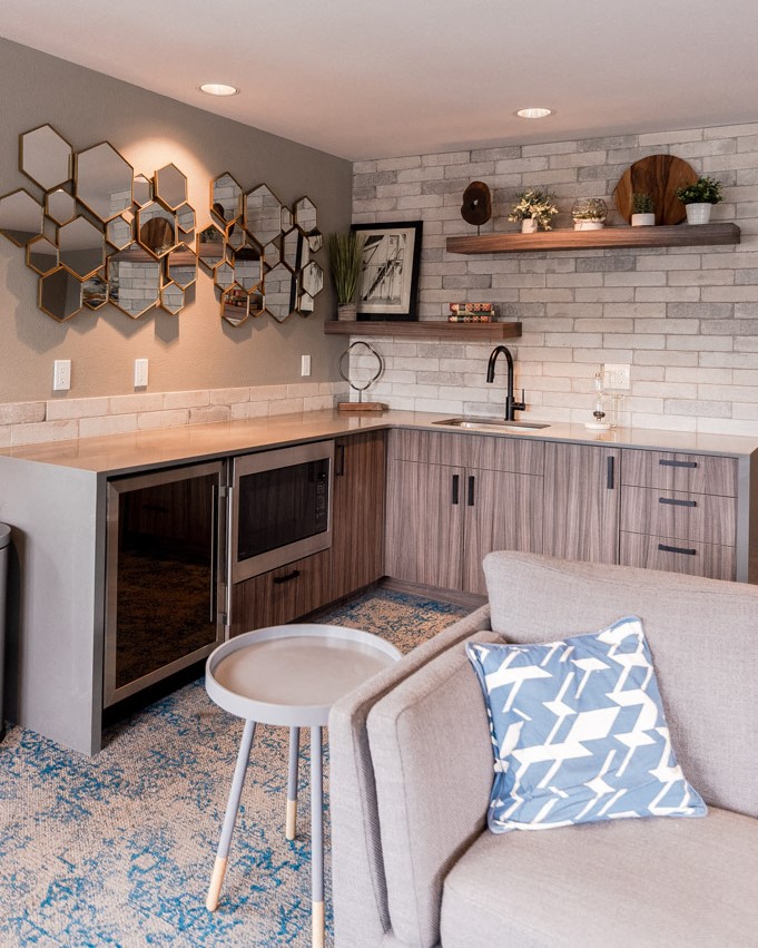 a small living room with a couch and a kitchen